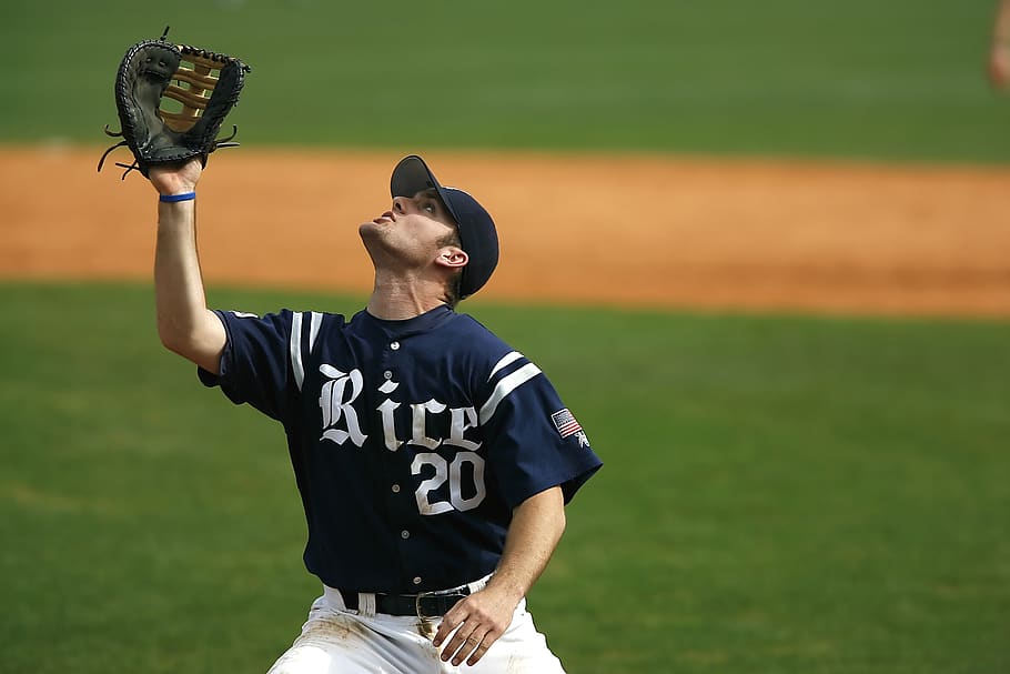 Man in Blue and White Rice 20 Jersey Looking Up during Daytime HD wallpaper