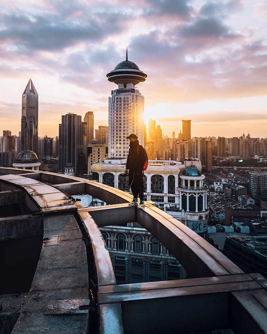 HD wallpaper: man standing on building edge, building exterior, built ...