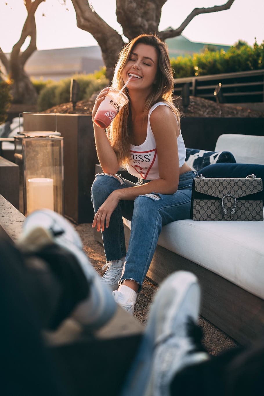 women's blue jeans, woman, depth of field, smoothie, drinking smoothie