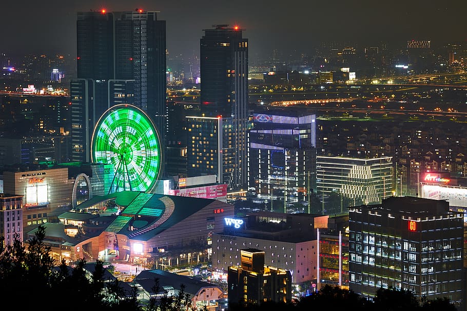 green and white ferries wheel in the city during nightime, urban