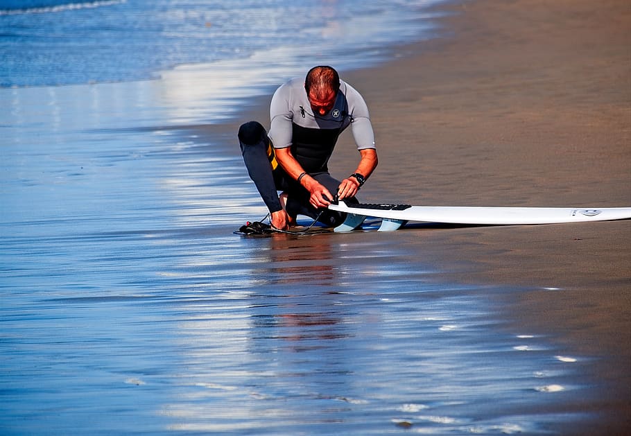 man holding surf board, person, human, oars, vessel, watercraft HD wallpaper