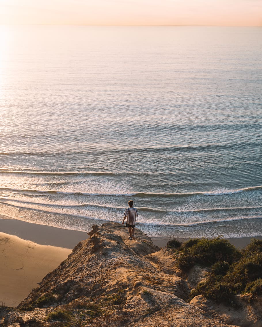 man standing on cliff, nature, outdoors, water, sea, ocean, person HD wallpaper