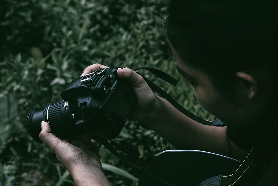 Person Holding Black Dslr Camera, blur, camera equipment, camera strap HD wallpaper