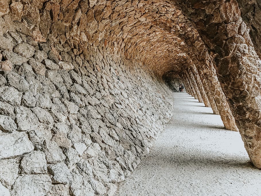 photo of brown concrete wall, barcelona, spain, park güell, architecture