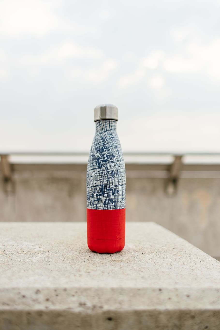 gray and red bottle on white concrete surface, wall, outdoors, HD wallpaper