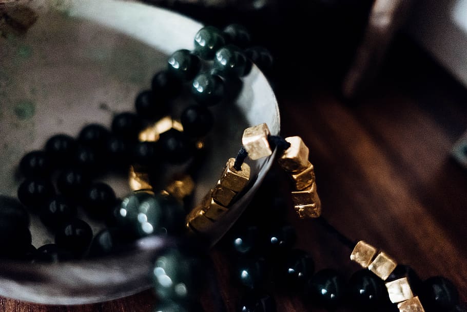 beaded black necklace on white surface, indoors, close-up, no people HD wallpaper
