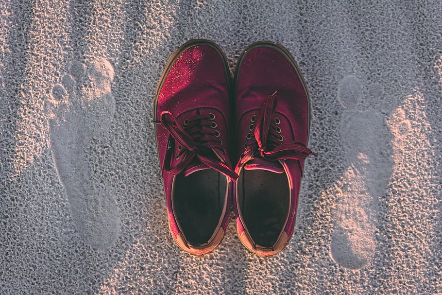 pair of red sneakers on sand, clothing, apparel, footwear, shoe, HD wallpaper