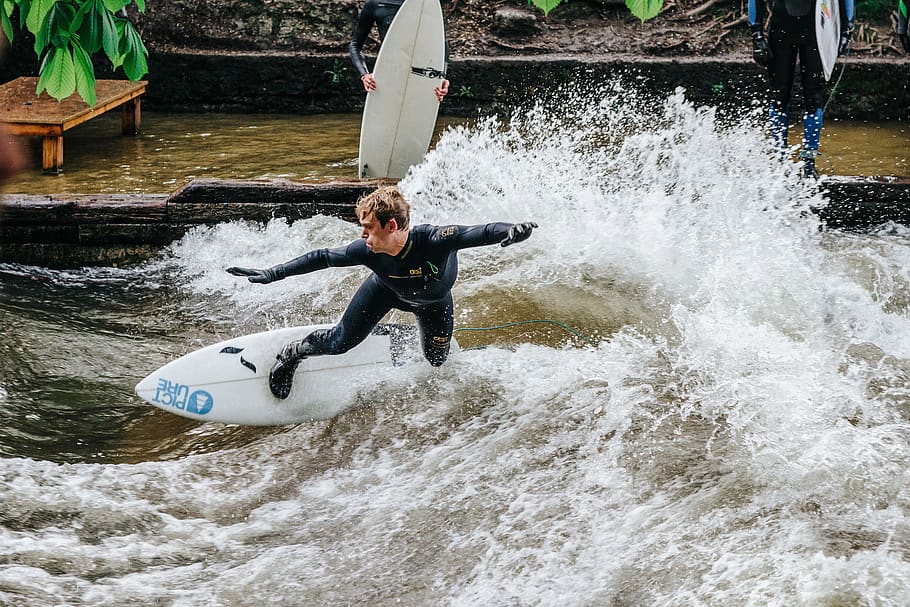 man riding surfboard and making tricks, motion, leisure activity HD wallpaper