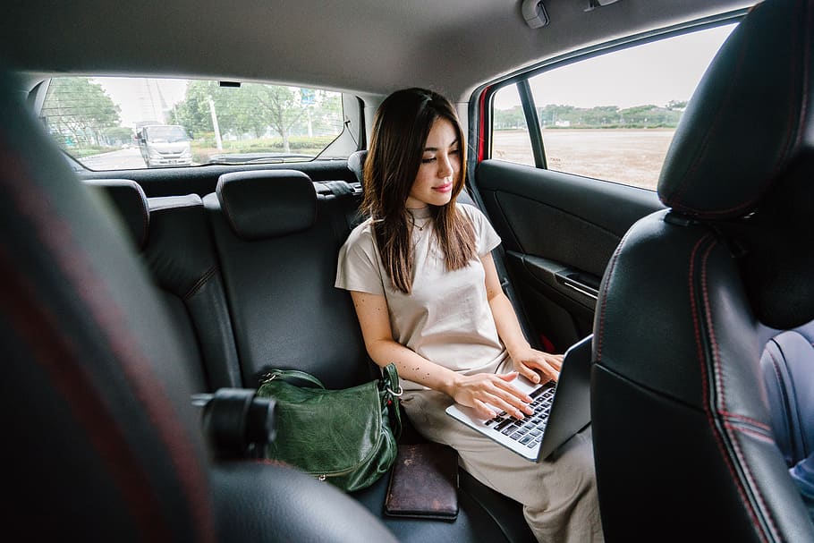 Woman Using Laptop Computer Inside Vehicle, beautiful, pretty HD wallpaper