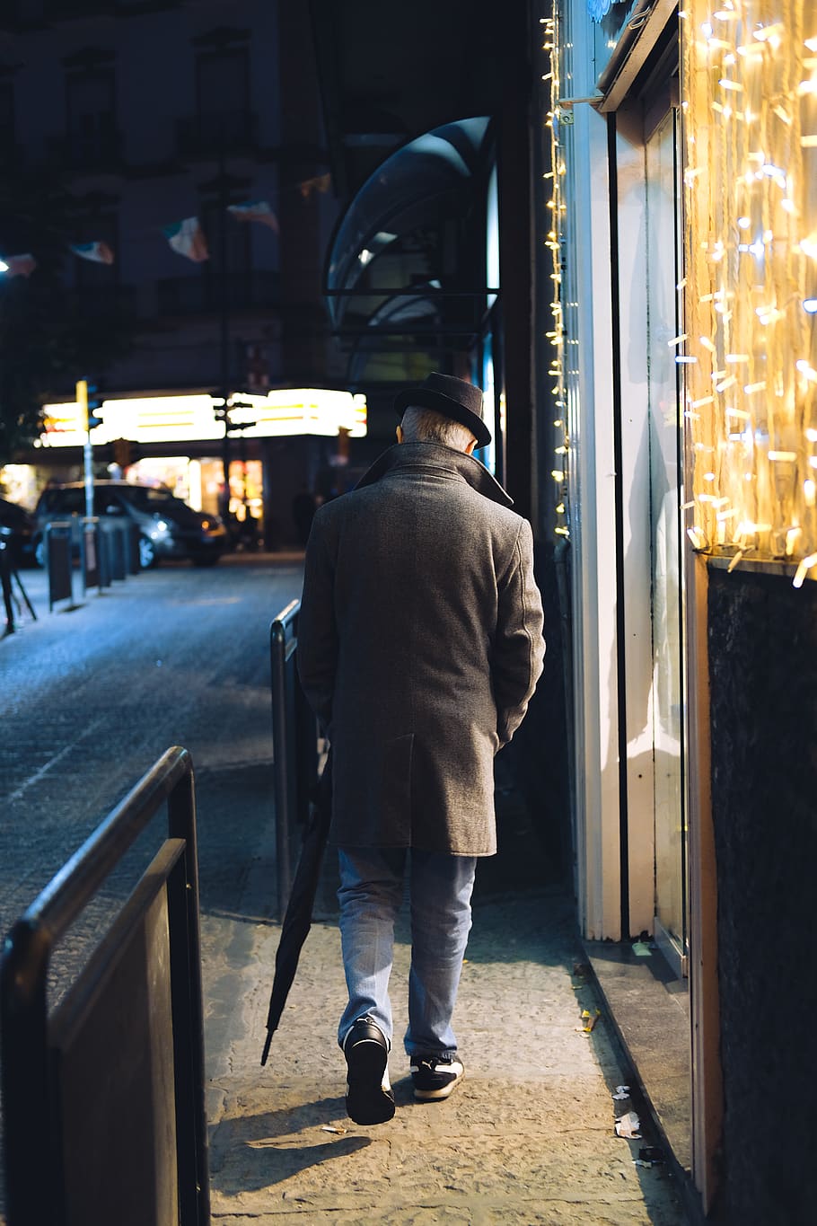 man walking beside string lights, apparel, shoe, footwear, clothing HD wallpaper