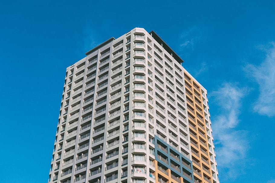 showing-white-and-beige-concrete-building.jpg