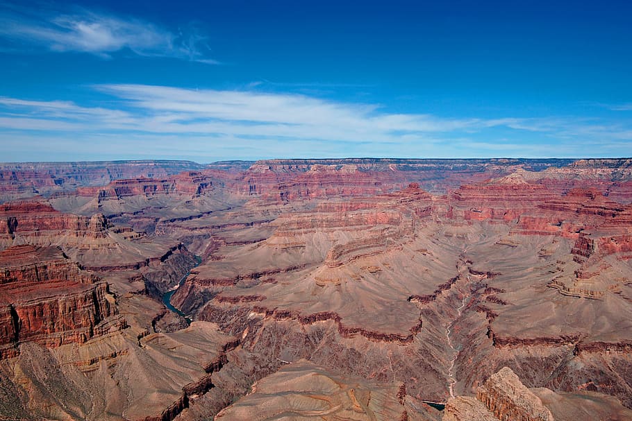 The ruggedness and deep hues of the Grand Canyon are displayed against a deep blue sky. This view is from the South Rim.