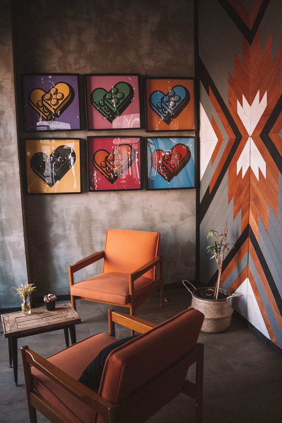 Two Orange Armchairs and Assorted-color Heart Wall Decors, architecture