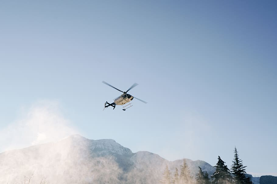 white helicopter on flight, mid-air, flying, sky, mountain, mode of transportation HD wallpaper
