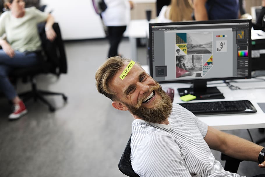 Man Laughing Beside Computer Monitor, adult, chill, connection