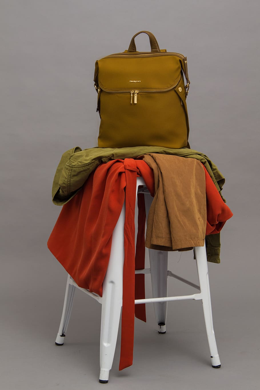 Brown Bag On Top Of Stool With Textiles, backpack, clothes, indoors HD wallpaper