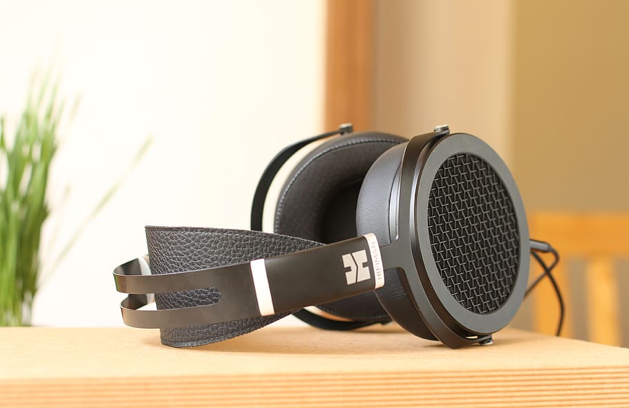 black headset on beige surface, indoors, table, technology, close-up HD wallpaper