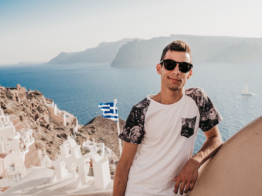 man leaning on mountain, people, person, human, greece, santorini HD wallpaper