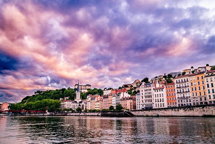 A cityscape view from the water in a France city., lyon, river