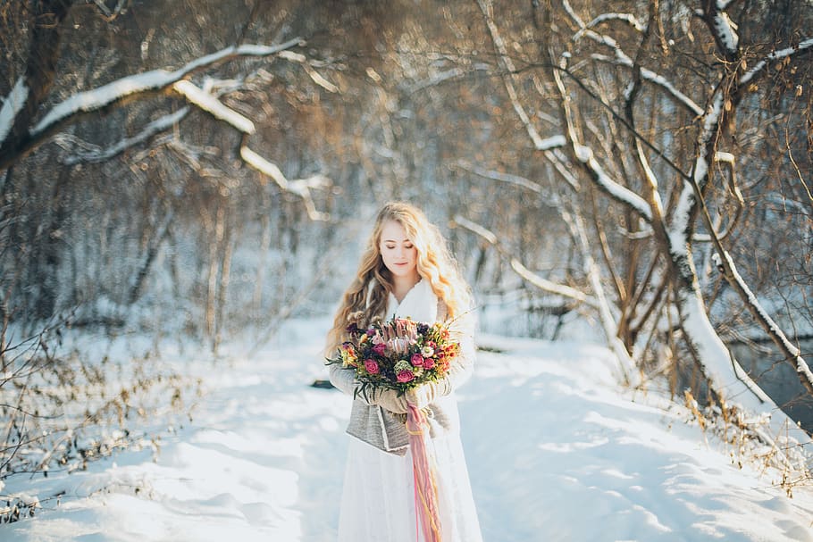 Woman Holding Flowers, bare tree, beautiful, bouquet, branches HD wallpaper
