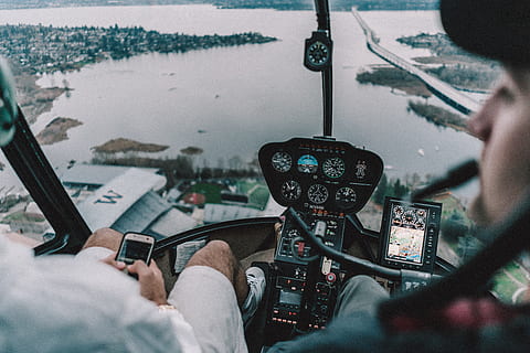 two persons riding helicopter, human, cockpit, city, building HD wallpaper