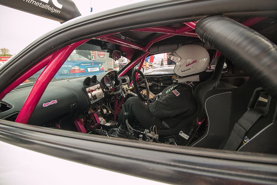 person driving car, clothing, helmet, apparel, vehicle, transportation HD wallpaper