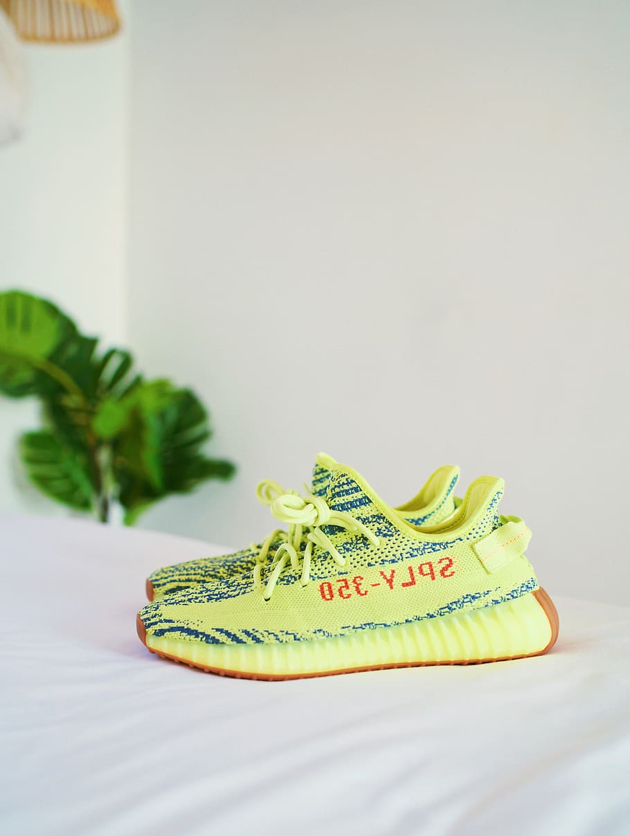 HD wallpaper: frozen yellow Adidas Yeezy Boost v2's on white bedspread, indoors - Wallpaper Flare