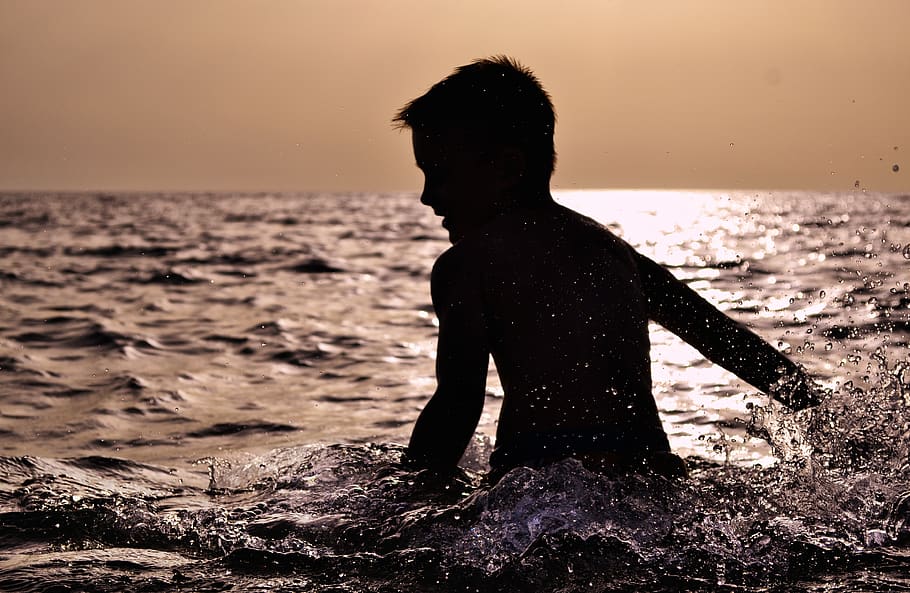 Silhouette of Boy on Body of Water, backlit, beach, blur, child HD wallpaper