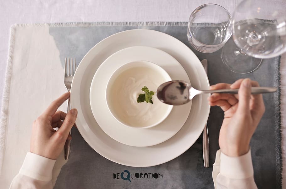 A closeup of soup bowl plate and cutlery with female hands, dinner HD wallpaper