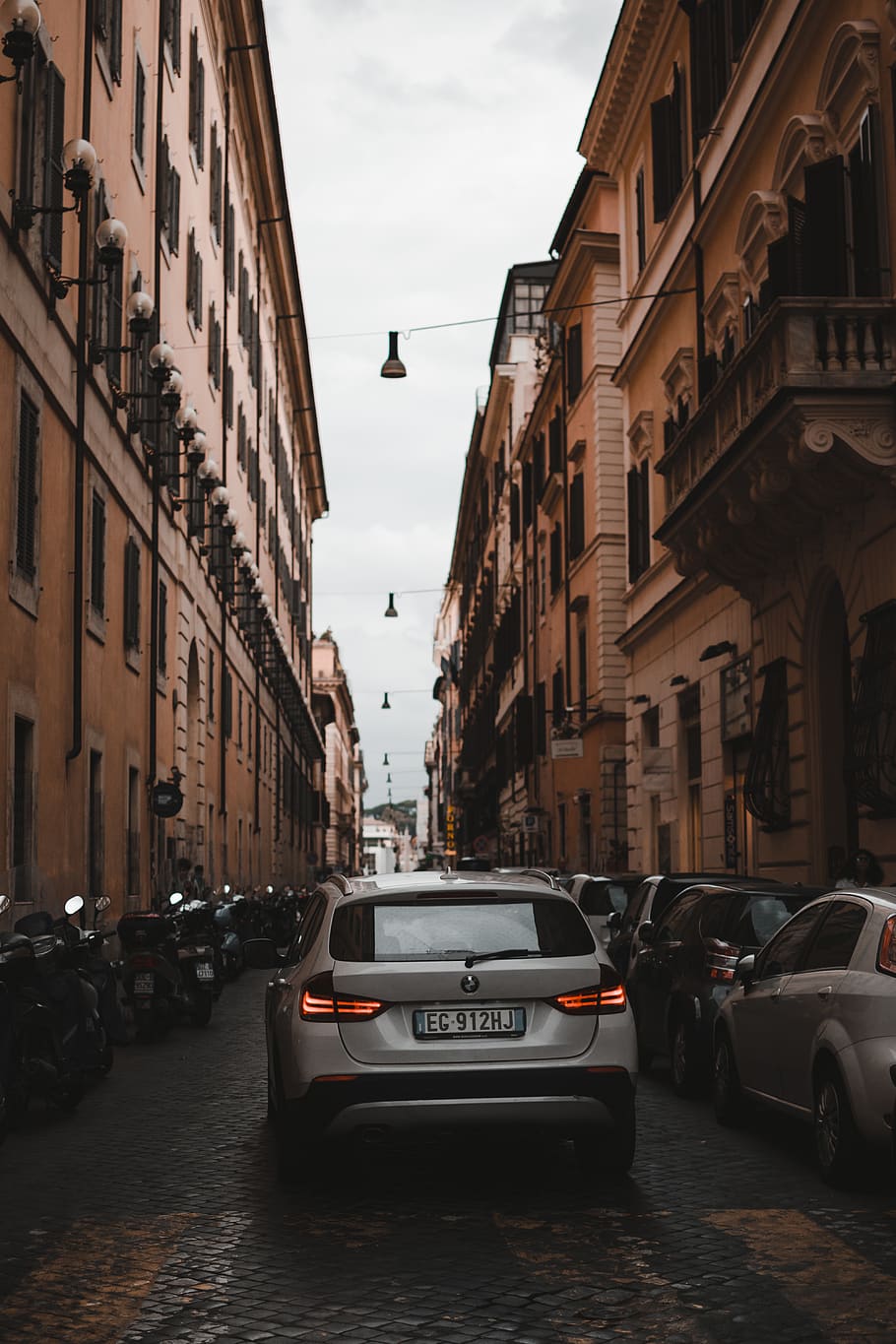 vehicle parked between buildings, motor vehicle, mode of transportation HD wallpaper
