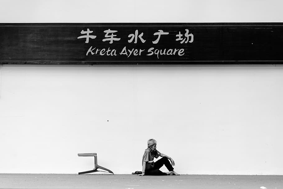 grayscale photo of woman sitting on the floor, person, human