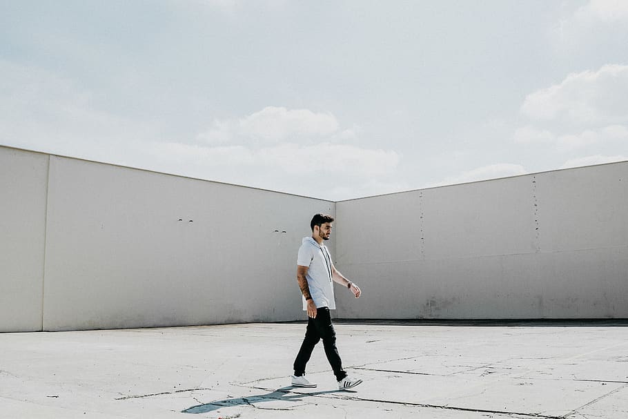 man walking on gray pavement, one person, full length, standing HD wallpaper