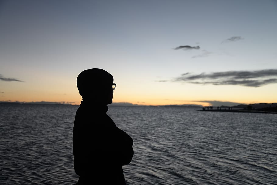 sunset, sky, water, silhouette, one person, beauty in nature HD wallpaper
