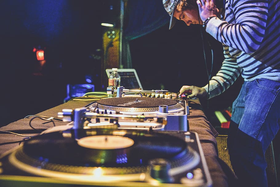an controlling audio mixer, real people, one person, music, indoors HD wallpaper