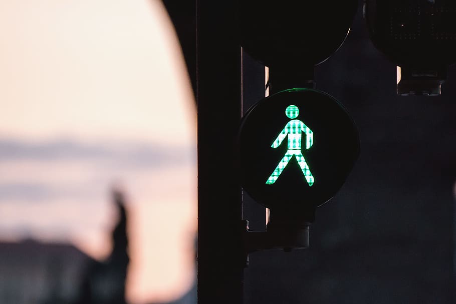 Traffic light on green, human representation, sign, guidance HD wallpaper