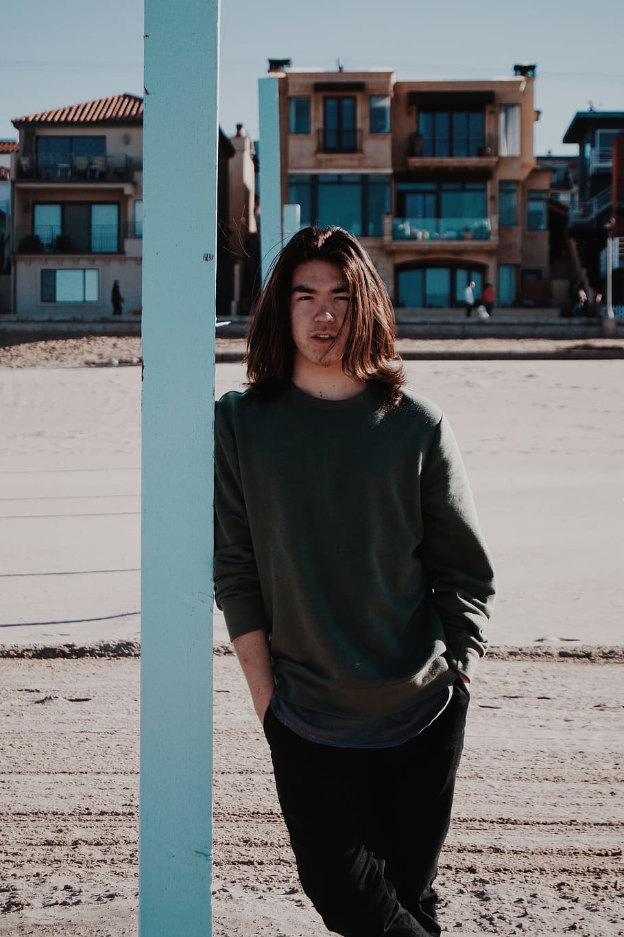 man standing while leaning on concrete post, apparel, clothing HD wallpaper