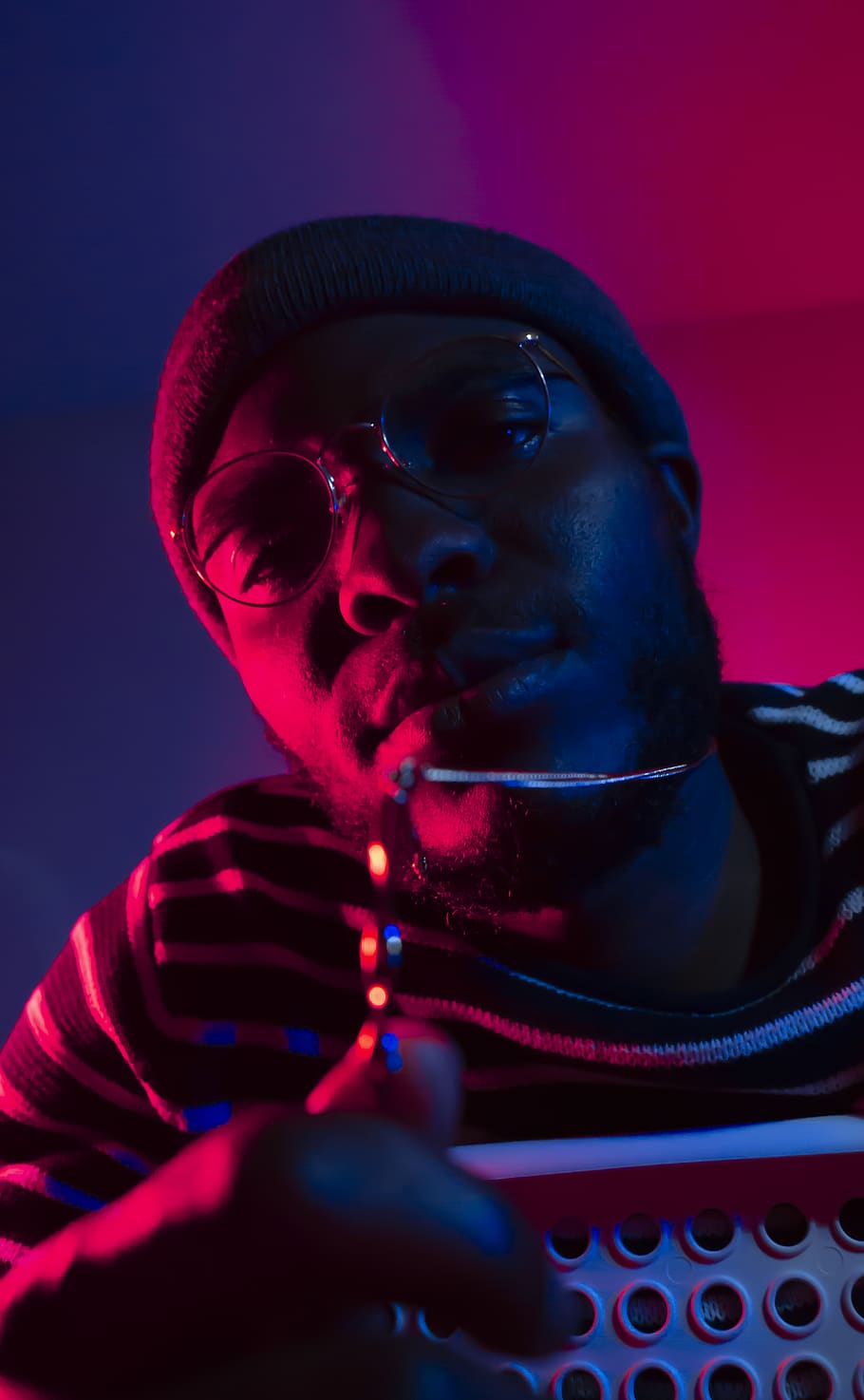 young African man in green lights at night, wearing sunglasses, in Munich,  Germany Stock Photo - Alamy