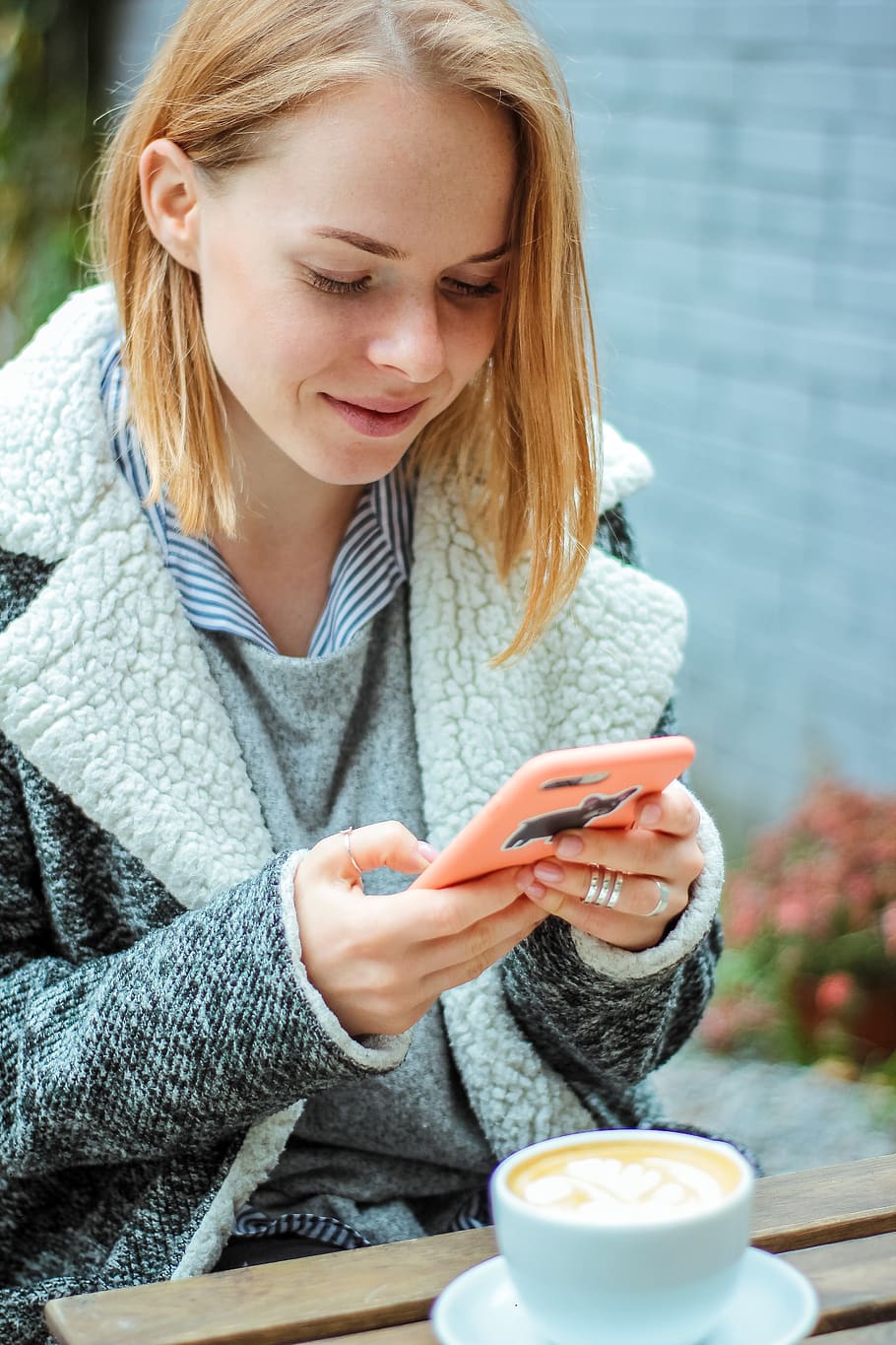 Woman in Gray Coat Sitting While Using Smartphone, beautiful HD wallpaper