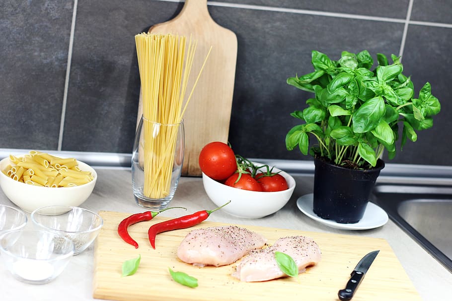 Raw Chicken Breast Seasoned With Peppers Beside Red Chili, Basil, Bowl of Tomatoes, and Raw Pastas on Table, HD wallpaper