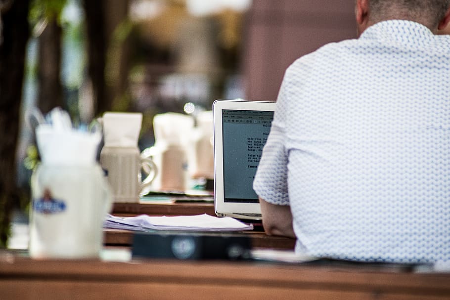 man using laptop, table, wireless technology, communication, connection HD wallpaper
