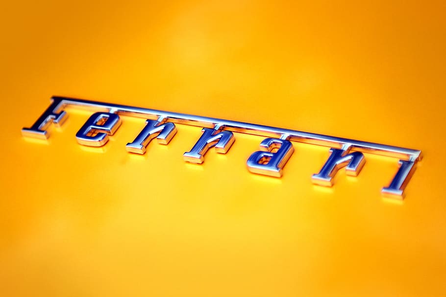 Ferrari emblem, logo, symbol, trademark, text, car, yellow, alphabet
