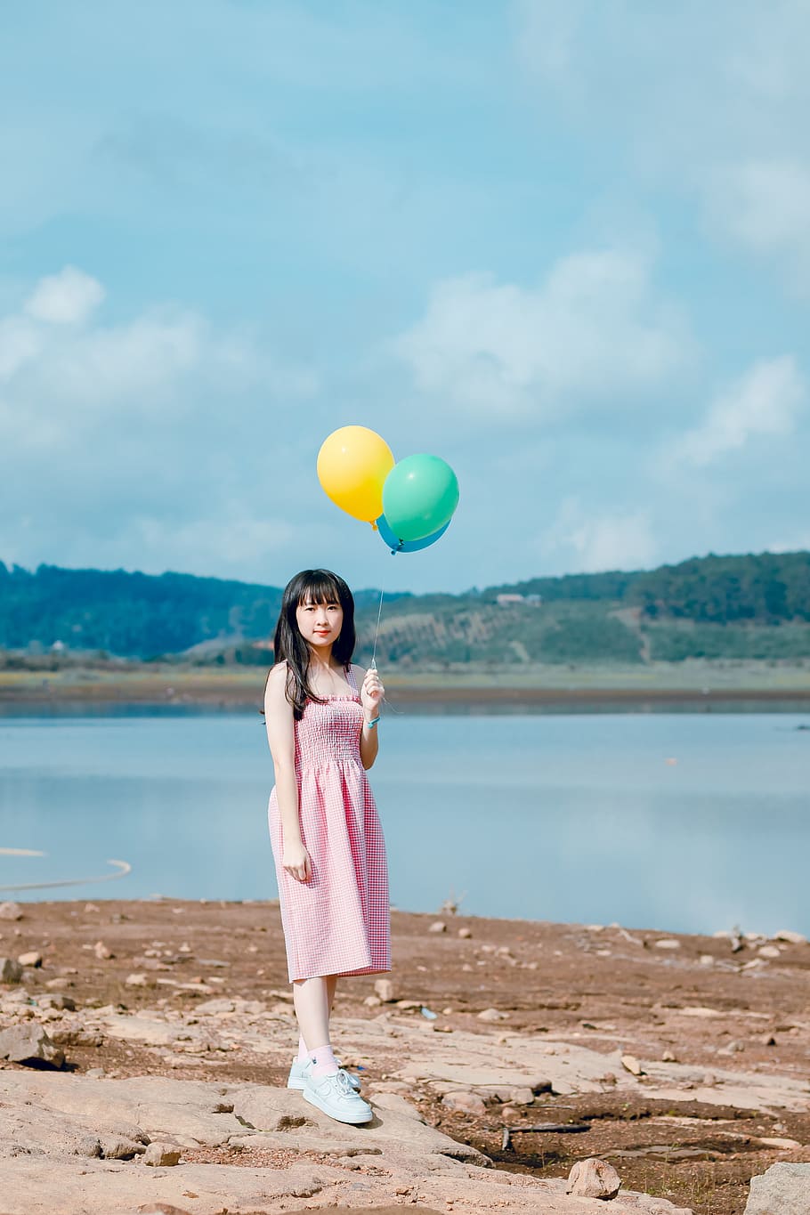 Woman Holding Balloons Standing on Beige Sand, alone, assortment HD wallpaper