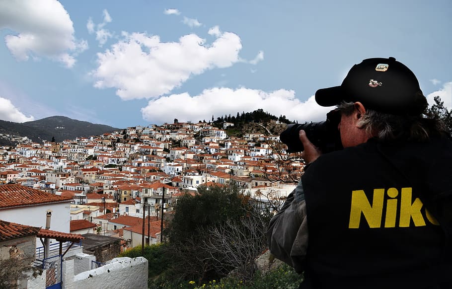 Man Taking Photo of Brown Houses, architecture, buildings, camera HD wallpaper