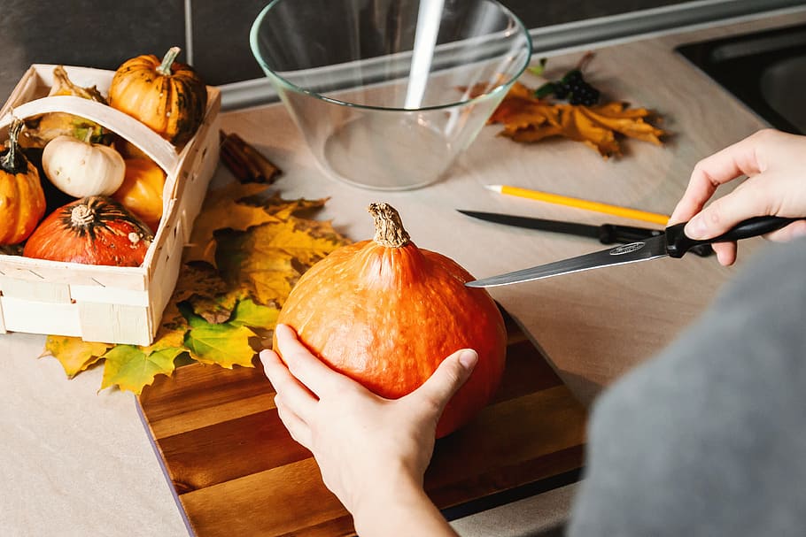Girls hands carve the pumpkin. Halloween., food and drink, human hand HD wallpaper
