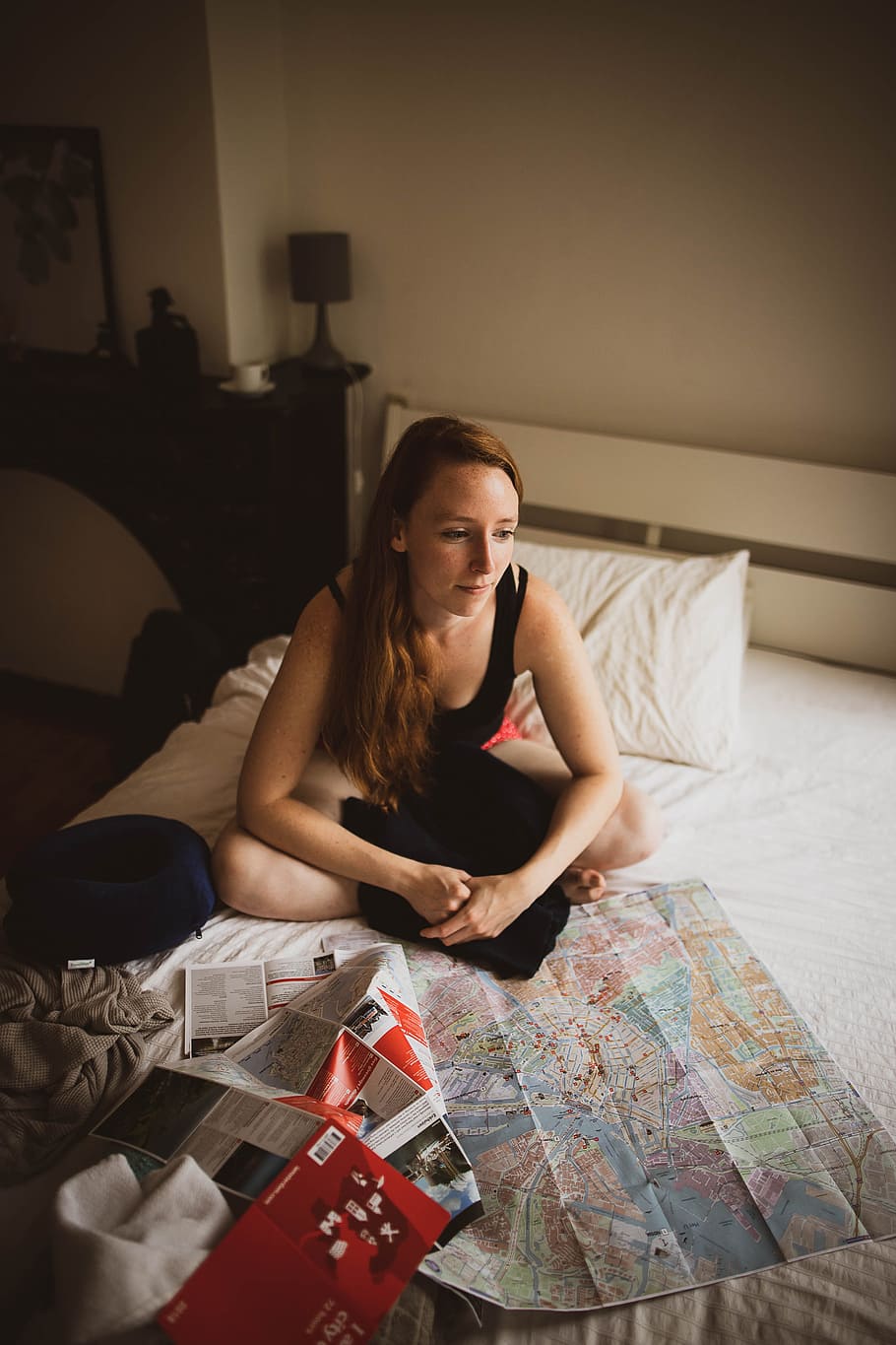 HD wallpaper: woman sitting on bed inside room, travel, bedroom, map,  ginger | Wallpaper Flare