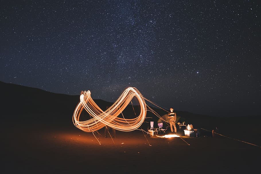 night sky, camping, sparks, fire, swirls, light, people, adventure HD wallpaper