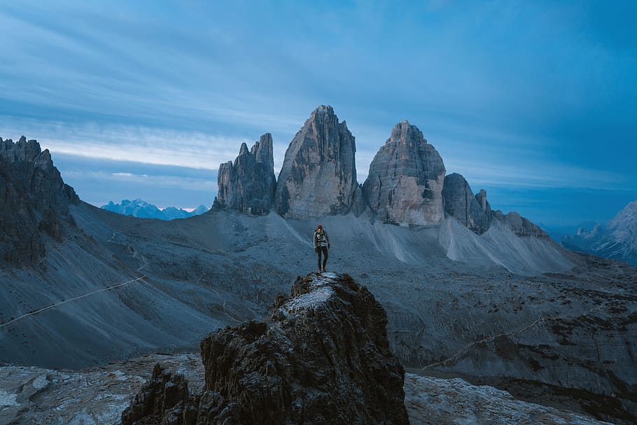 aerial photography of person standing on rock formation, cloud HD wallpaper