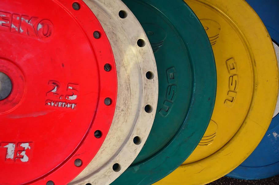 red, yellow, white, green, weights, eleiko, discs, stacked