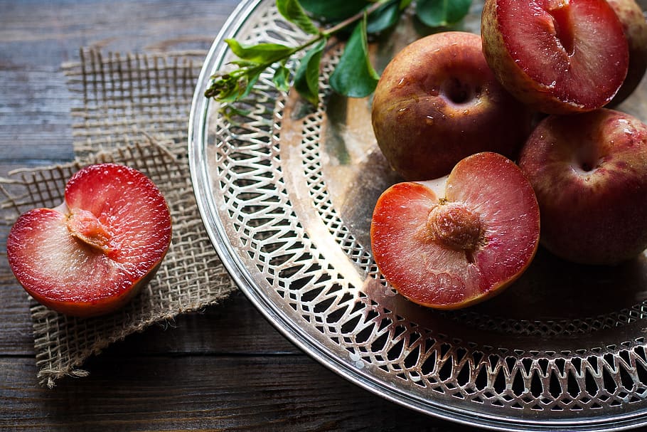 Sliced Plums on Silver Round Platter, blur, close-up, focus, fresh HD wallpaper