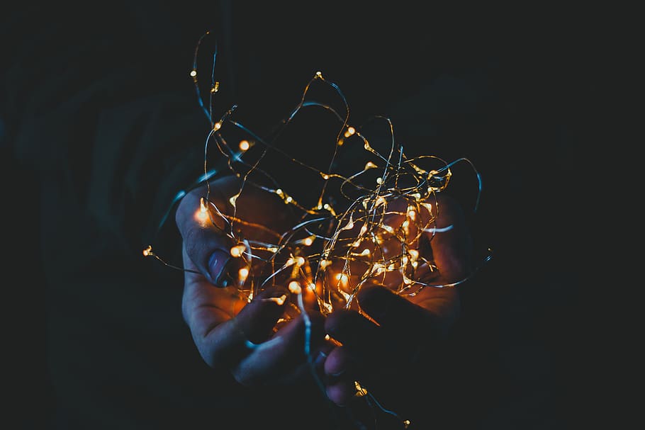 person holding string lights, christmas light, fairy lights, glow HD wallpaper